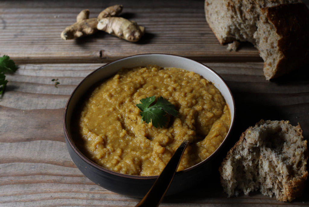 bowl of curried red lentils pairs well with sugar snap pea salad