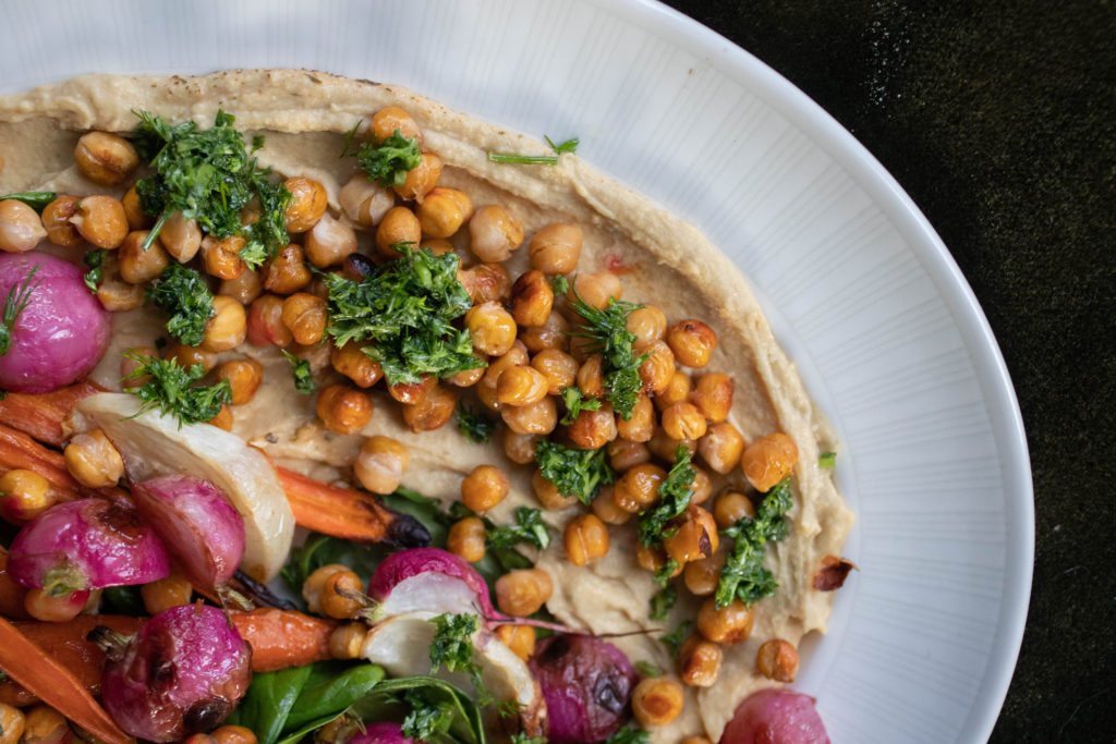 Hummus Salad with crispy roasted chickpeas and parsley sauce