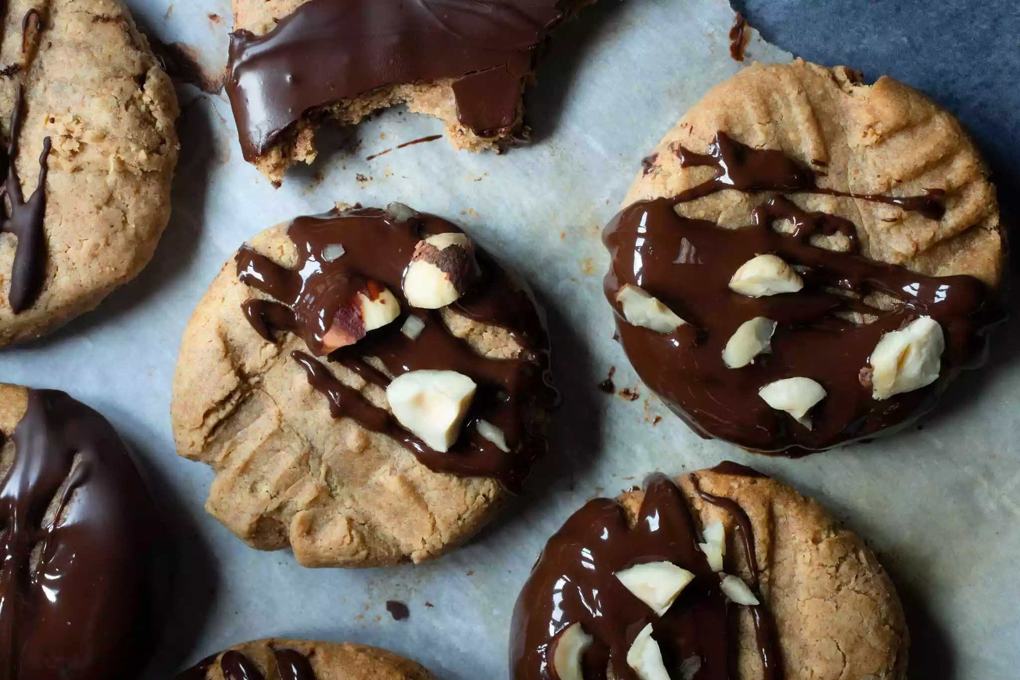 cashew butter cookies spread on parchment paper